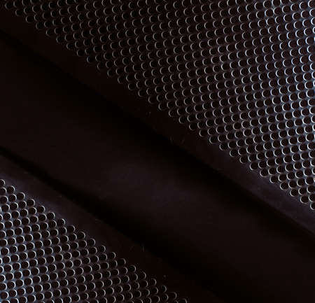 Front image of metal grille of amplifier or music loudspeaker.の写真素材
