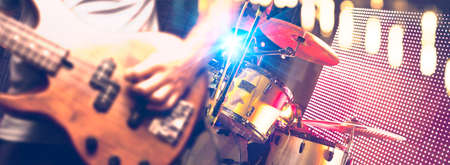 Bassist and drum in the stage.Night entertainment and leisure.Pop and rock band in concertの写真素材