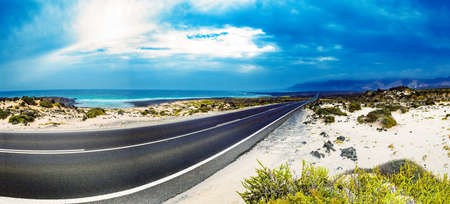 Road through the scenic landscape to the destination.の写真素材