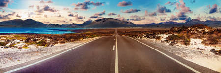 Road through the scenic landscape to the destination in Lanzarote natural parkの写真素材