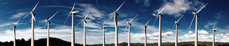 Wind mills farm and sunset landscape.