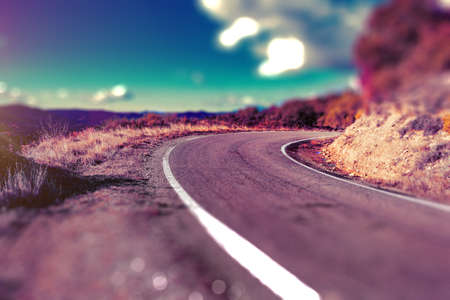 empty asphalt road and nature landscape at sunsetの写真素材