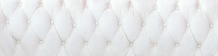 White leather upholstery background in widescreen format.の写真素材
