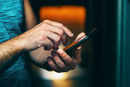 Sending an sms and sharing content on social networks from inside the homeの写真素材