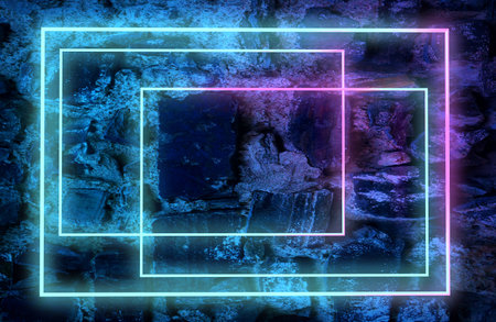 Neon lights and concrete floor in a dark interior space.の写真素材