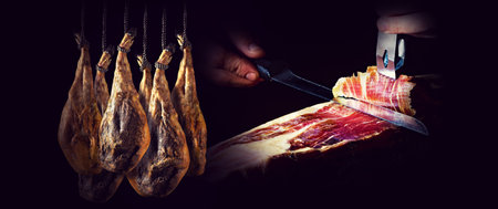 Slicing Spanish Iberian ham. Spanish ham and traditional food.の写真素材