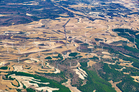 Aerial view of wind farm in the field.