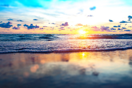 Beach sand and sunset on the shore.の写真素材
