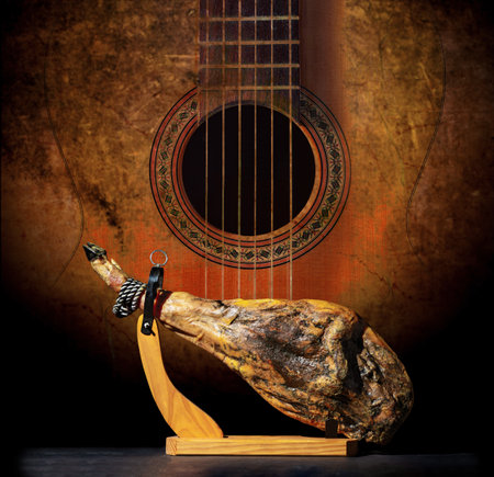 Slicing Spanish Ã­beric ham. Design Spanish jamon and spanish guitar, traditional food and culture.の写真素材