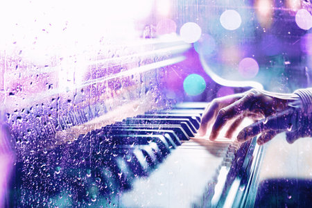 Piano behind the window with water drops on a rainy day. Relax music and sad piano for travel road.の写真素材