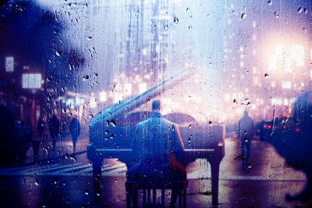 Piano behind the window with water drops on a rainy day. Relax music and sad piano for travel road.の写真素材