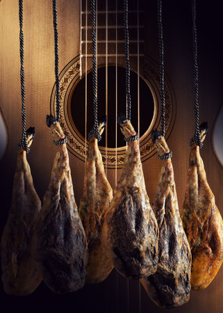 Slicing Spanish Ã­beric ham. Design Spanish jamon and spanish guitar, traditional food and culture.の写真素材