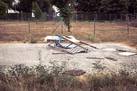 broken swing in playground after fireの写真素材