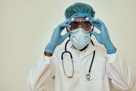 Male Doctor Adjusting Protective Eyewear