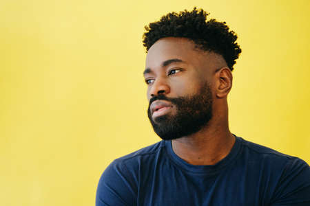 Thoughtful Afro Man With Beard Looking Away
