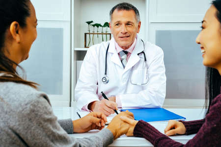 doctor and happy patients in hospital healthcare physician practitioner