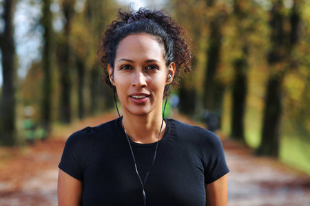 close up woman outdoors headphonesの写真素材