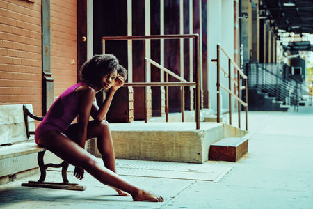 ballerina modern dancer outdoors sittingの写真素材