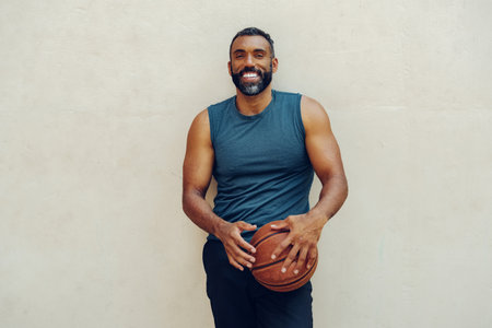 Athletic Man Basketball Player Holding Ballの写真素材