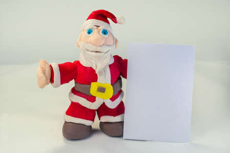 santa handmade in plasticine holding card on side