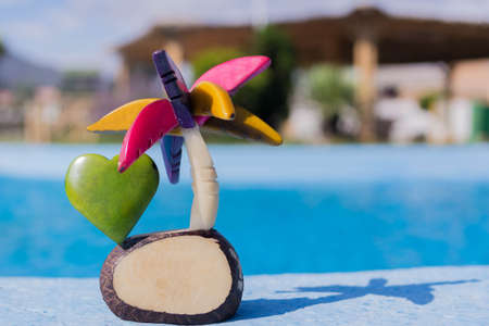 handmade tagua palm on blurred city backgroundの写真素材