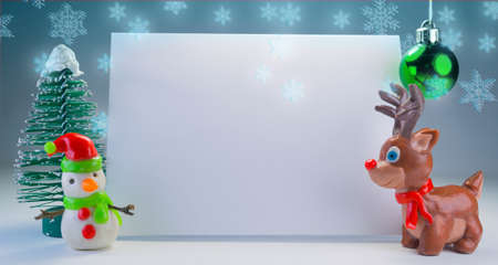 postcard background with reindeer and snowmanの写真素材