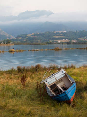 Boat at dusk in Sella river in Ribadesella province of Asturiasの写真素材