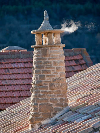 Smokestack in cold weather with some smokeの写真素材