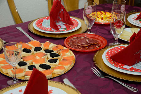 Christmas dinner table with fish and special decorationの写真素材