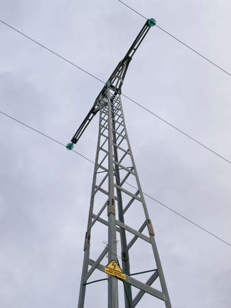 Powerline pole over a cloudy sky