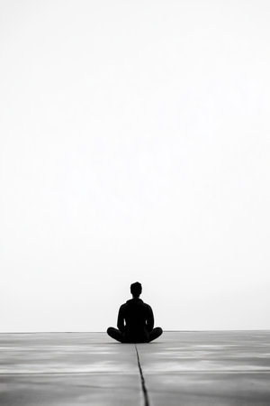 A man is sitting on the ground, looking up at the sky. The sky is cloudy and the man is in a contemplative mood. AI generated.の素材