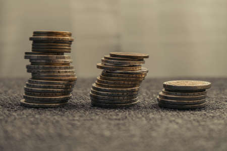 A set of stacked coins background.の写真素材