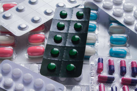 Pack of pills and capsules background.の写真素材