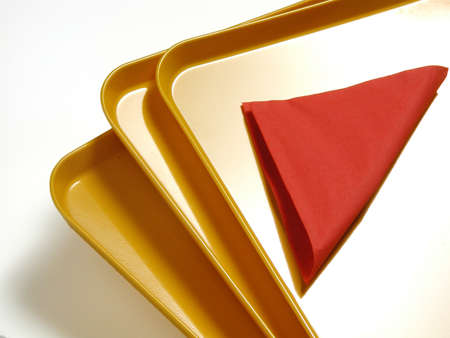 Beautiful image of yellow trays with red napkinの写真素材