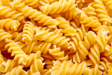 dried pasta fusilli backgroundの写真素材