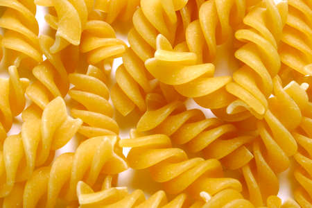 dried pasta fusilli backgroundの写真素材