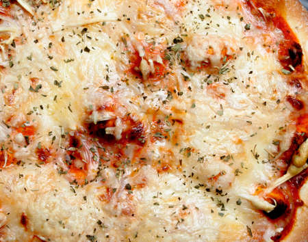 Close up of tasty pizza with tomato and cheeseの写真素材