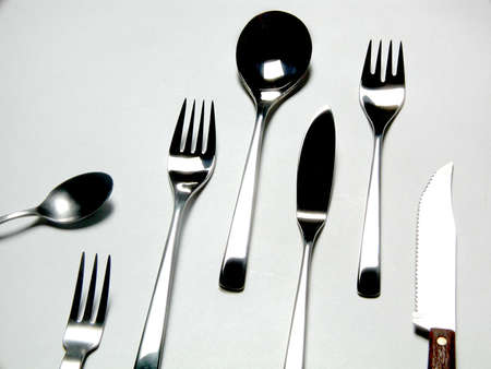 set of silver cutlery on white backgroundの写真素材