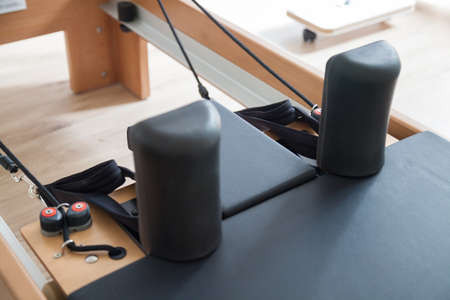 Reformer pilates studio machine for fitness workouts in gym
