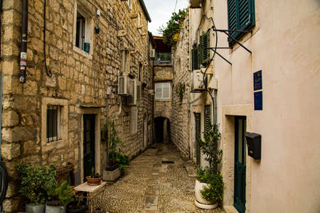 Duvrobnik city in Croatia, medieval walls and narrow streets on the side of a large mountain with...