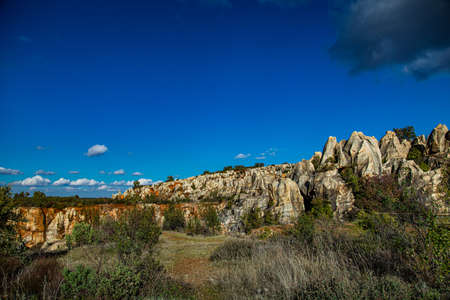 Natural park of eroded stone and red sand forest, with abandoned iron mine. Iron hillの写真素材