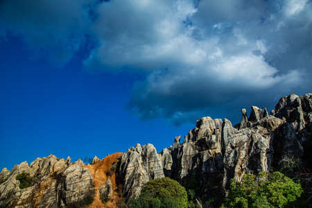Natural park of eroded stone and red sand forest, with abandoned iron mine. Iron hill
