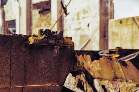 Abandoned mining operation with large coal dumps and town with dilapidated buildingsの写真素材