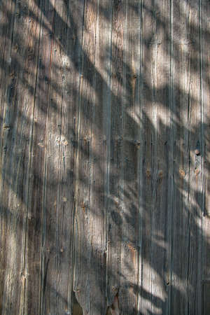 Garage with rusty and abandoned car and wooden texturesの写真素材