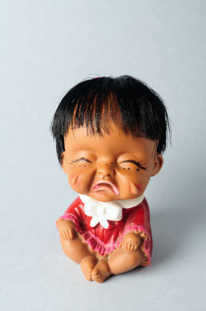 Oriental girl doll crying