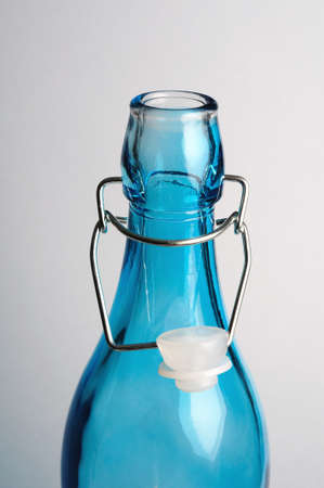 Classic bottle with hinged cap.