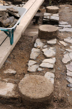 Working in the patio of the " Domus " Archaeological site " Chao Samartin " Asturias SPAIN Working in the patio of the " Domus " Archaeological site " Chao Samartin " Asturias SPAIN