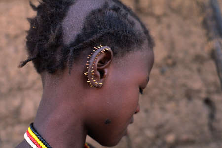 SENEGAL. Tambacounda Region   ( Bassari Country )  BEDIK    " Village of Iwol  " ;  Girl with porcupine quills in his ear.のeditorial素材