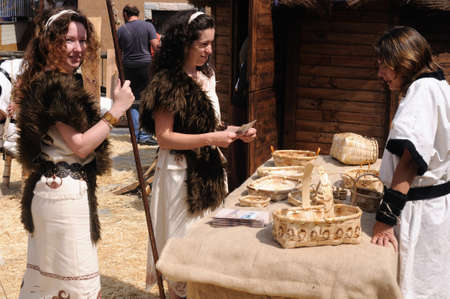 Astur women dressed in traditional basketwork  stall  " Astur-Roman Festival of  La Carisa "  CARABANZO  Asturias SPAIN.のeditorial素材