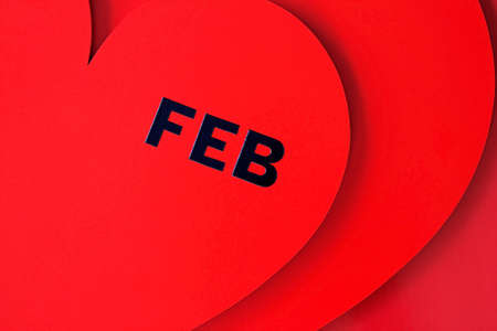 Valentines Day dated in red heart isolated on redの写真素材